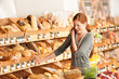 Grocery store: Red hair woman with mobile phone