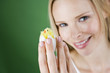 A young woman holding an Easter chick toy