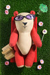 sunbathing toy bear