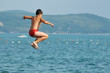 Foto: boy jump sea boy jump sea