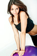 Young woman on white background in a fitness pose Young woman on white background in a fitness pose