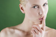 A young woman touching her lips