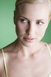 A portrait of a young blonde woman looking sideways
