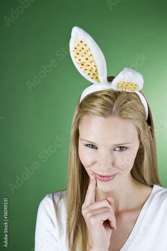 Photo: A young blonde woman wearing rabbit ears A young blonde woman wearing rabbit ears