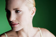 A portrait of a young blonde woman looking away