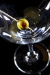 Olive on a martini glass