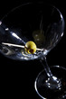 Olive on a martini glass