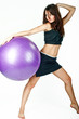 Young woman on white background in a fitness pose Young woman on white background in a fitness pose