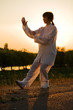 Foto: woman in white suit make's taiji chuan exercise - 10 woman in white suit make's taiji chuan exercise - 10