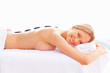 Massage therapy: Young woman relaxing at a spa