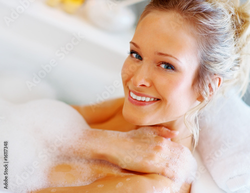 Portrait of a lovely female having a bubble bath