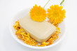 Calendula and soap in mortar, close-up