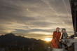 Couple in front of mountain hut