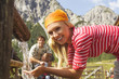 Austria, Salzburger Land, woman drinking water, man in the background