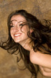 Topless woman beaming with joy