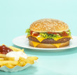 Cheeseburger with French fries, close-up
