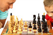 Foto: The daddy and the son play chess The daddy and the son play chess