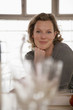 Woman in kitchen, smiling, portrait
