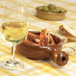 Prawns in bowl with glass of wine on table