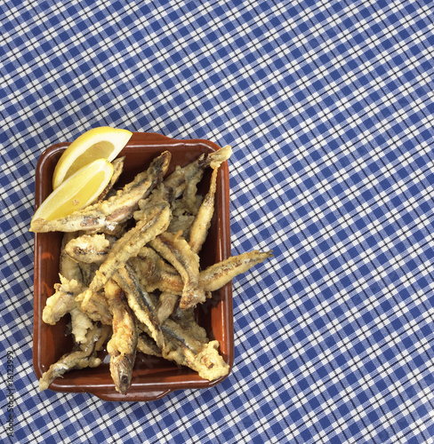 Photo: Deep fried sardines in bowl, close-up Deep fried sardines in bowl, close-up