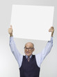 Businessman holding cardboard, portrait