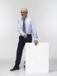 Businessman holding cardboard, portrait