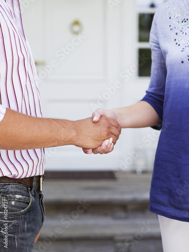 Photo: Man and woman shaking hands Man and woman shaking hands