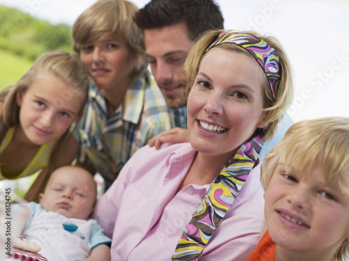 Photo: Family in garden with baby Family in garden with baby