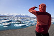 Photo: Female Hiker Looking at Iceberg Filled Lagoon, Jokulsarlon, Icel Female Hiker Looking at Iceberg Filled Lagoon, Jokulsarlon, Icel