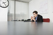 Foto: View of a businessman sitting in an office. View of a businessman sitting in an office.