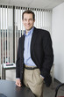 Foto: Portrait of a businessman smiling. Portrait of a businessman smiling.