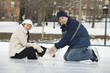Young couple ice skating