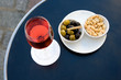 Parisian street cafe table with aperitif kir cassis and nibbles