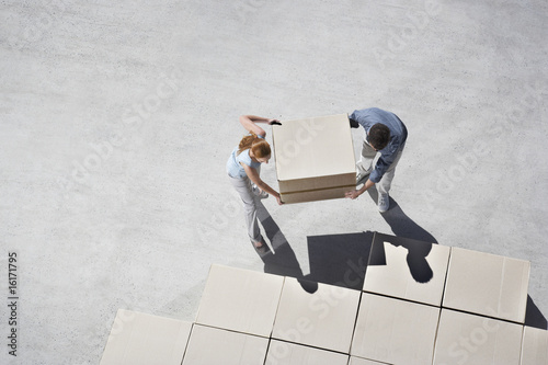 Photo: Couple organizing boxes Couple organizing boxes