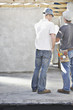Construction workers inside unfinished new home