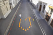 Man standing with traffic cones in shape of u-turn