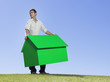 Man holding small model house Man holding small model house