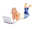 Excited cute female using a laptop while on the floor, white bac