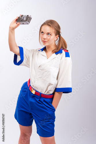 Photo: pretty young female blonde sailor standing with camera isolated pretty young female blonde sailor standing with camera isolated