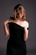 Photo: sexy pretty woman in black evening dress isolated on gray sexy pretty woman in black evening dress isolated on gray