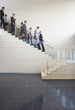 Businesspeople walking on office staircase