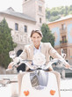 Man riding scooter