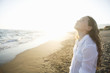 Girl daydreaming on beach