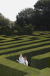 Young couple lost in hedge maze