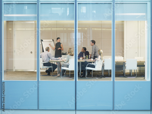 Photo: Businesspeople having meeting in conference room Businesspeople having meeting in conference room