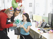 Businessmen giving birthday gift to co-worker