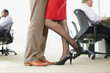 Businesspeople hugging in office