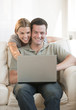 Couple Looking at Laptop Couple Looking at Laptop