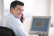 Businessman With Phone and Computer Businessman With Phone and Computer