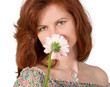 woman smelling a flower